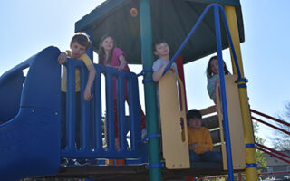 four children on a playground