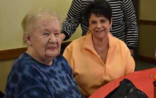 Two ladies enjoying a senior event